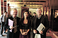 Dr. David Nunan and Dr. Rod Ellis speak to Anaheim University online TESOL Certificate graduate Christine Park during conference