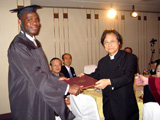 Dr. Kurokawa presents diploma to AU MBA Graduate Michael Paul