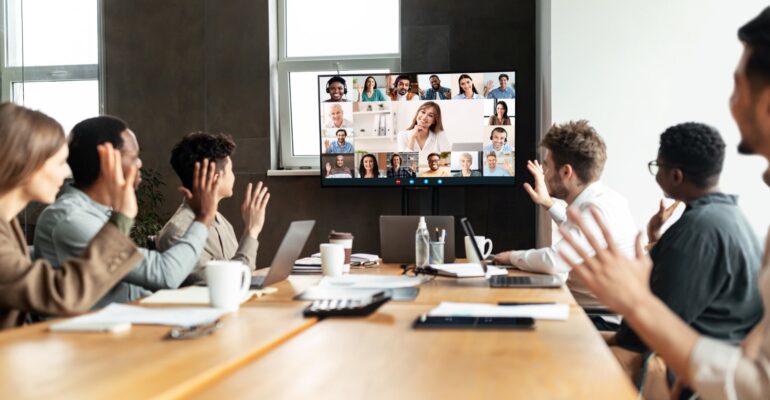 Diverse businesspeople making online video call to employees