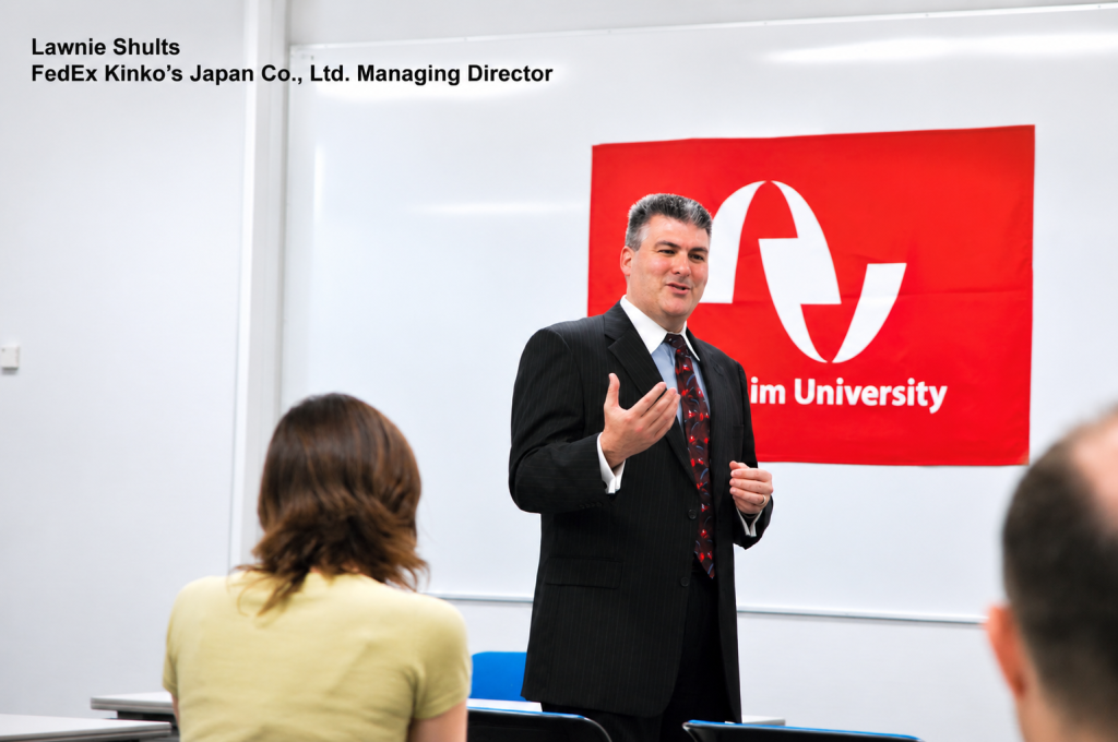 FedEx Kinkos Japan Managing Director Lawnie Shults speaks to Anaheim University MBA students at the Anaheim Univerity Akio Morita Learning Center in Tokyo